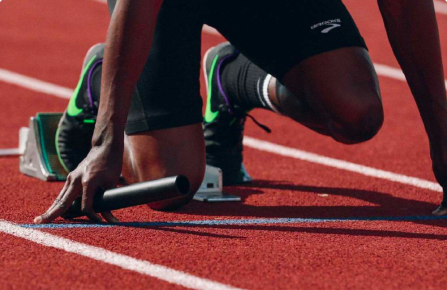 Man at starting line on track