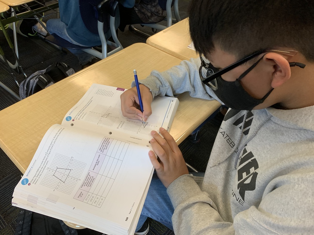 student working on his math